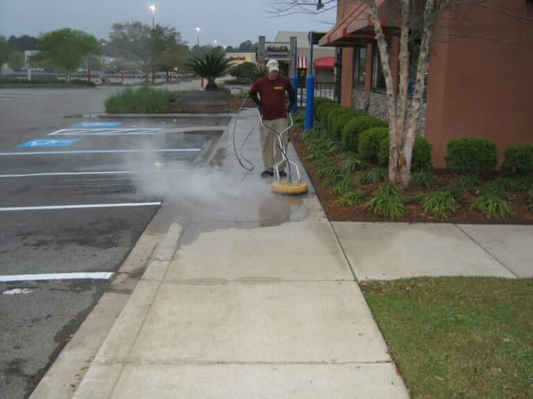 2012 Applebee's pressure washing walkways with hot water.