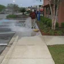 2012 Applebee's pressure washing walkways with hot water.